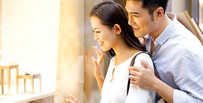 person and person looking at a window
