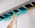 Worker applying 3M™ FireDam™ Spray