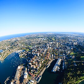 Panoramic photo of Sydney city skyline on ocean front.