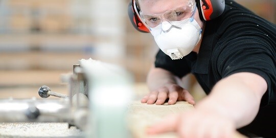 3M Disposable Respiratory protecting man from saw dust
