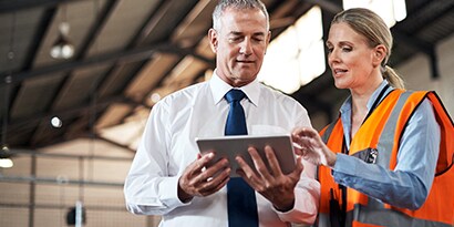 Administrators use road and highway assent management software on a tablet.
