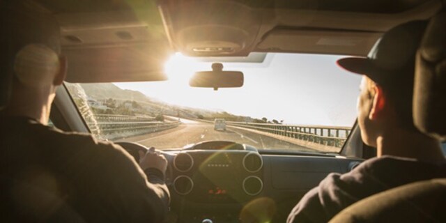 Couple driving, dashboard view.