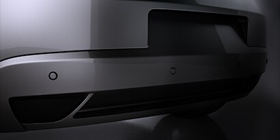 gray scaled photo of sensor on a vehicle bumper
