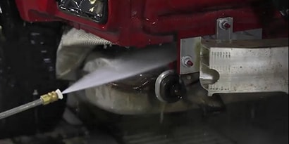 spray cleaner removing old sealers from components to prep for repair
