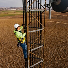 Telecom worker fixing cell tower network