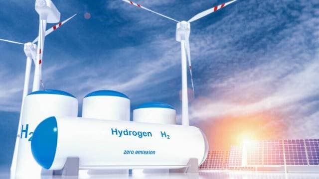 Wind mills and hydrogen storage tanks.