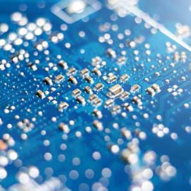 Microscopic view of blue printed circuit board tiny components