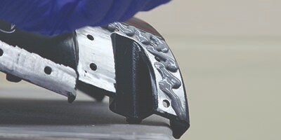 adhesive being used to repair a structural component of a vehicle