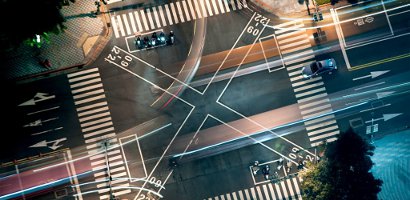 Busy junction at night from above
