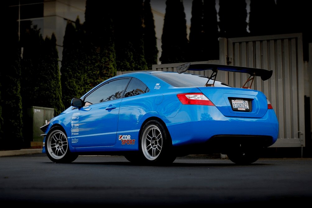 blue car parked on the road