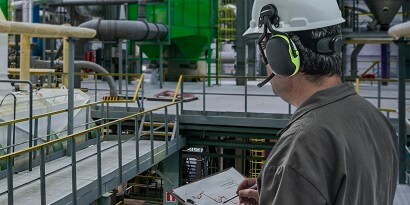 Worker wearing two-way radio headset
