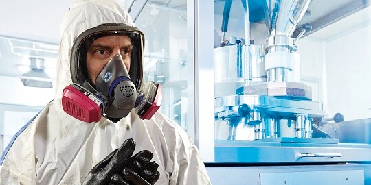 3M Respirator protecting man from organic vapors 
