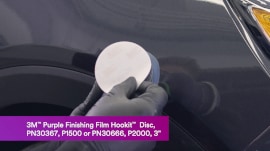 Hookit disc being attached to sander
