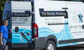 a plumbing company's fleet van wrapped in 3M graphic film with their company logo to increase brand awareness on the road as they travel to jobs.