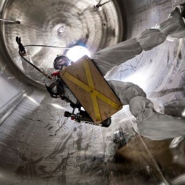 Man in a confined space wearing 3M Respiratory protection