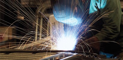 Welder assembling metal structure
