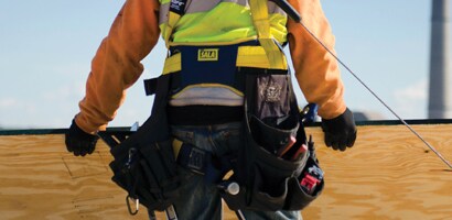 Worker wearing back and tool support belt
