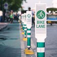 Row of bike lane signs identifying protected bike lane.