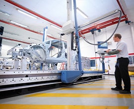man assembling a body-in-white using 3M solutions at an OEM