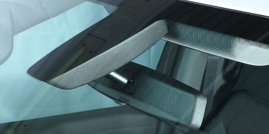 Bonding rearview mirror to glass
