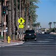 Yellow and black signs with image of pedestrian and words “next 1000 feet.”