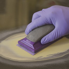 body filler being sanded