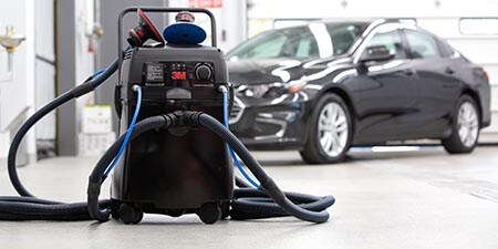Image of clean sanding system in a body shop
