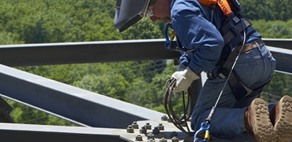 Construction worker in fall protection PPE
