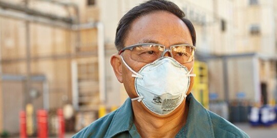 3M Disposable Respirator protecting man from nuisance odors 
